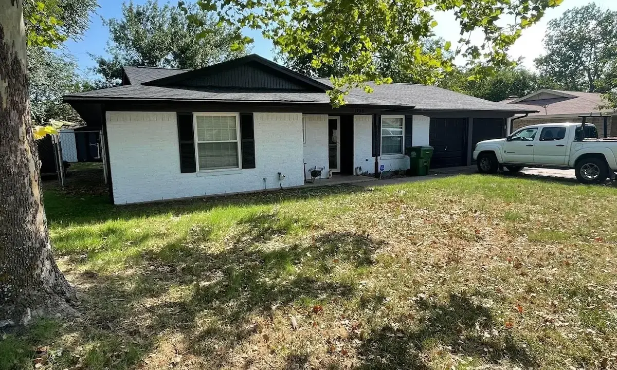 Professional roofing crew working on a residential roof in East Renton Highlands